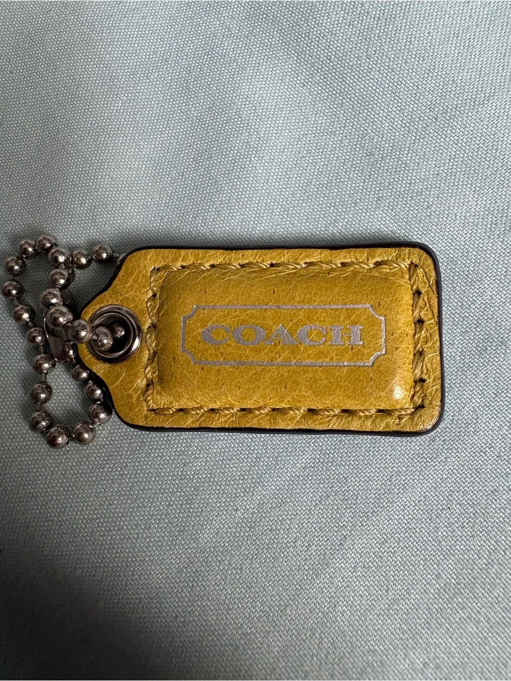 Tiny Coach Yellow Leather Logo Keychain Tag